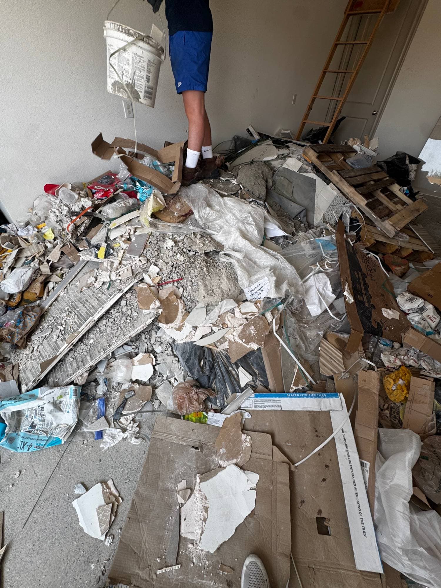 Massive tile demolition and construction rubble pile before HAULR removal